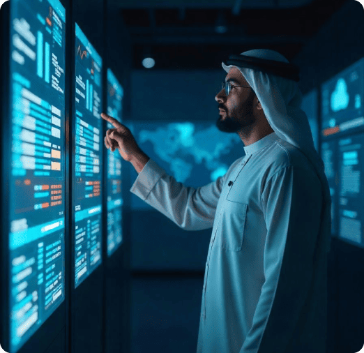 Person interacting with digital data displays.